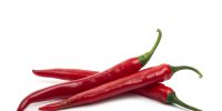 Red fresh chili peppers isolated on white background Red fresh chili peppers isolated on white background. High quality photo